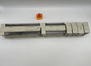 Mitsubishi MELSEC PLC FX2N-80MR-DS, FX2N-48ER-DS, FX2N-16EX-ES/UL, (2) FX2N-16EYR-ES/UL, FX2N-8EX-ES/UL (Used)